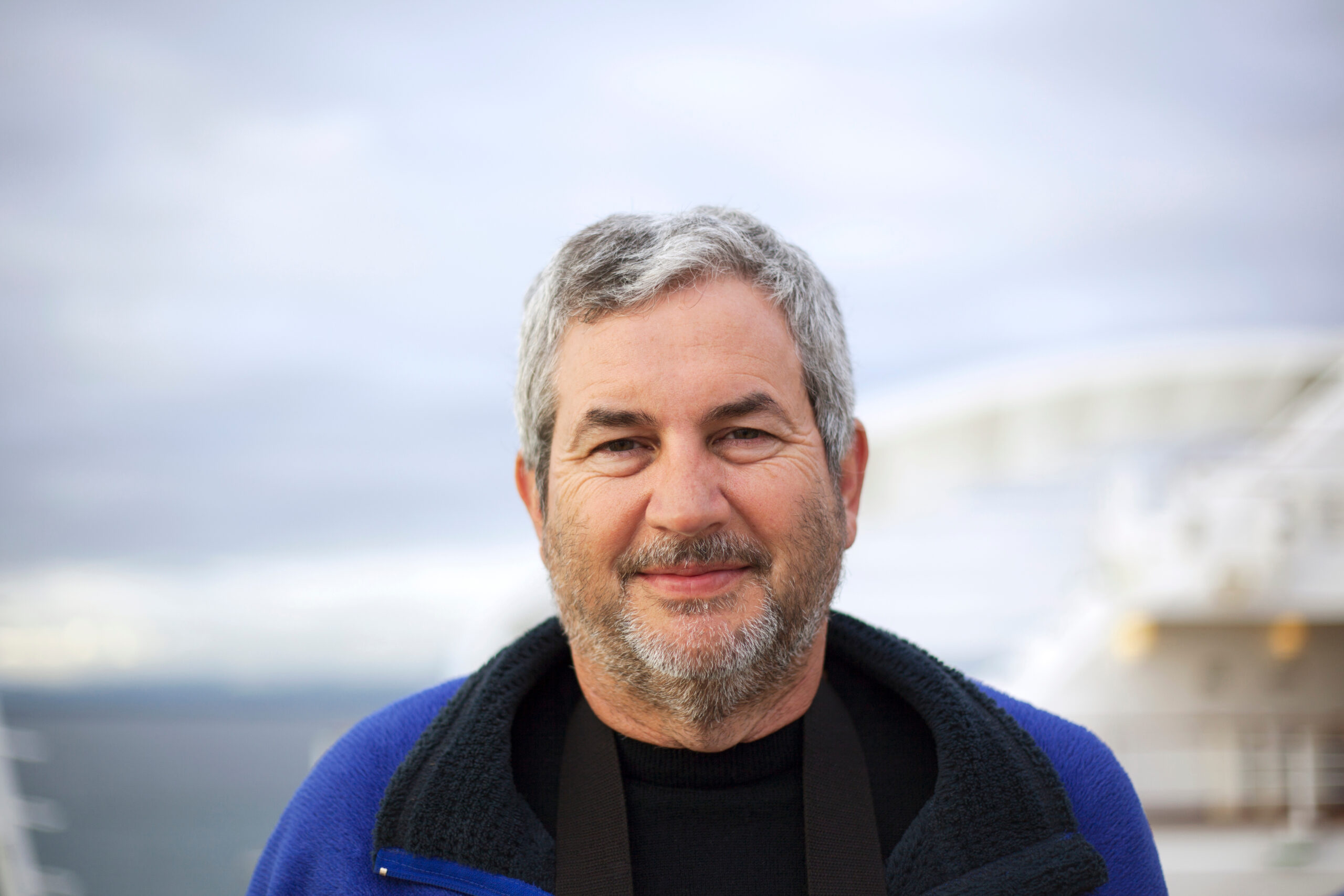 Portrait of smiling man against sky